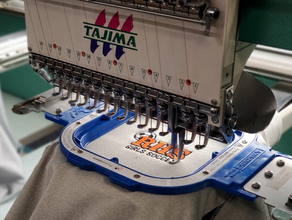 67c0a7ed7542c_rhs-soccer-on-machine-1024x771 A machine is being used to embroider clothes.