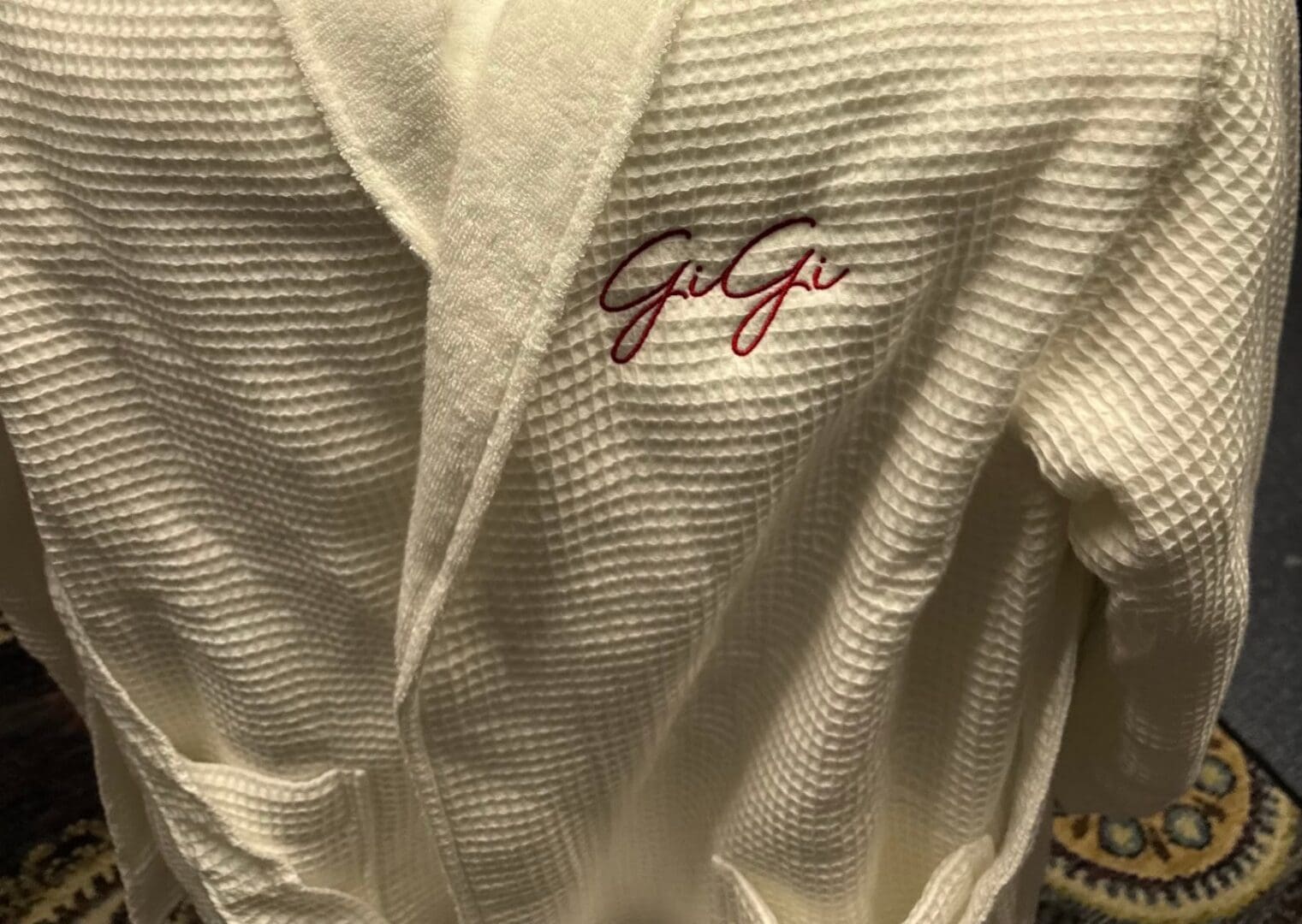 White waffle robe personalized with the name GiGi in red embroidery
